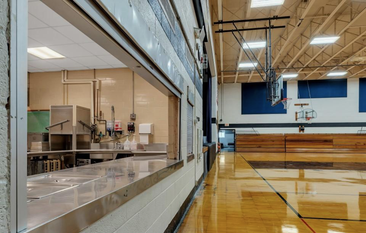Kitchen serving window with gym view