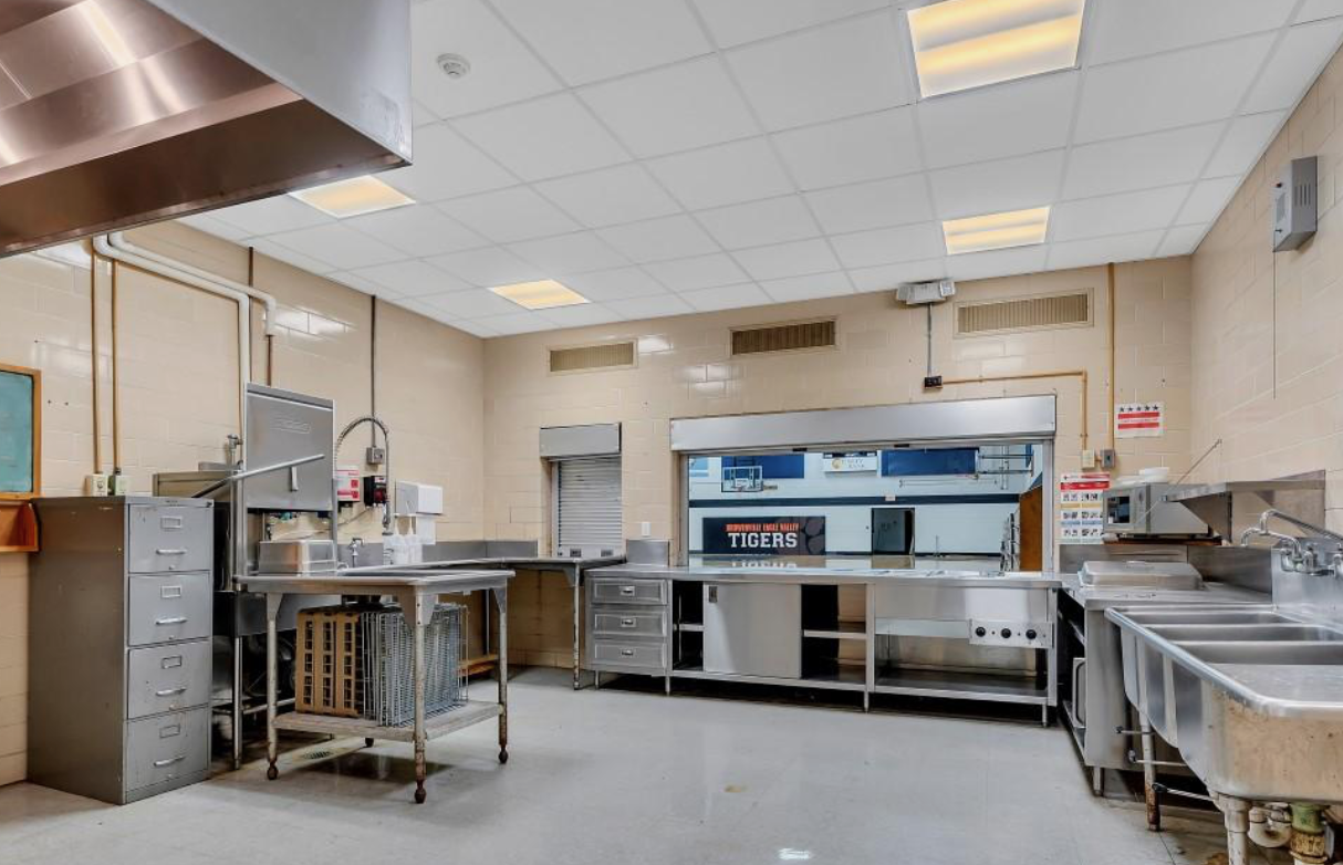 Commercial kitchen with stainless steel equipment